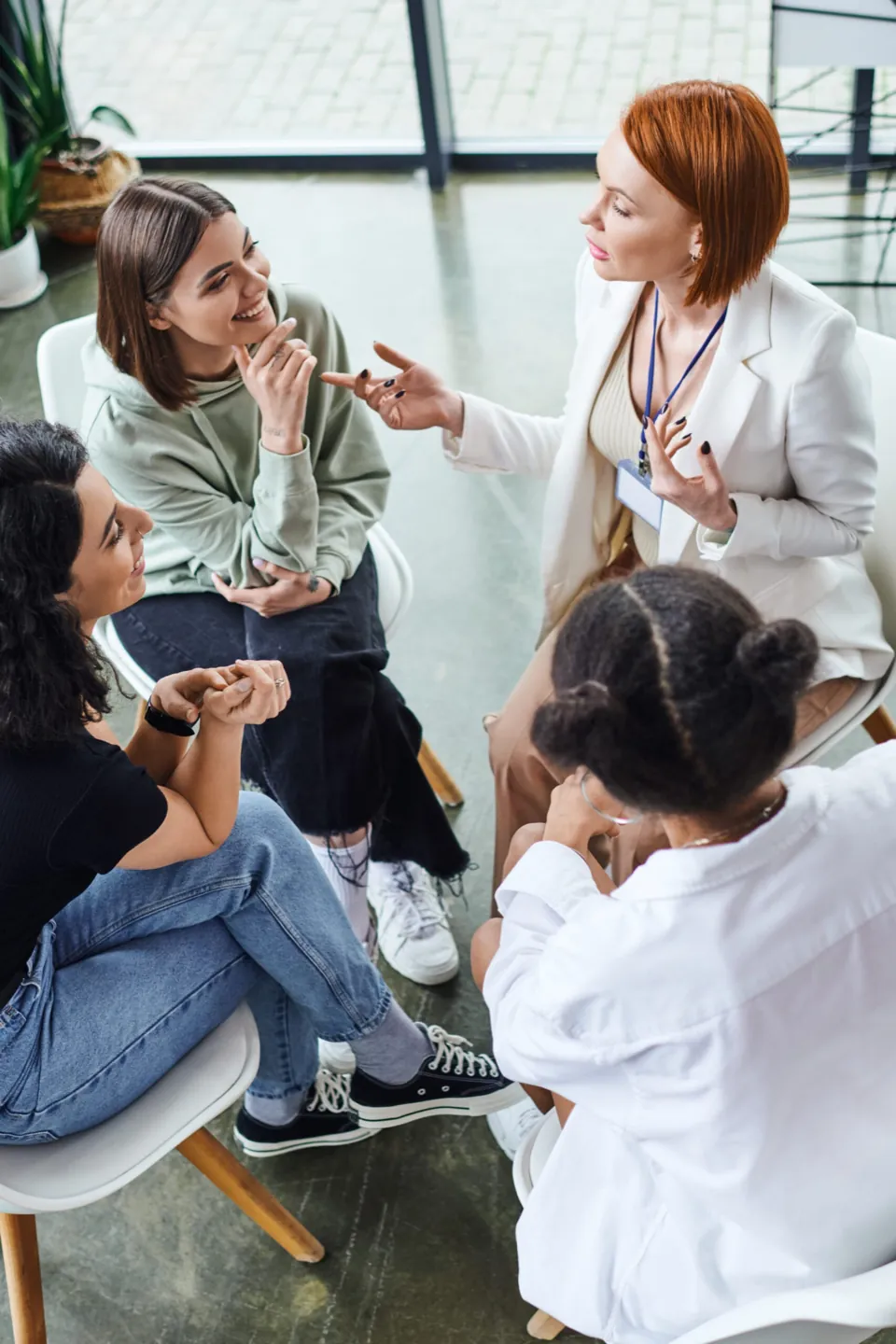 Teens practicing coping skills together in a group therapy session at Ethos Wellness