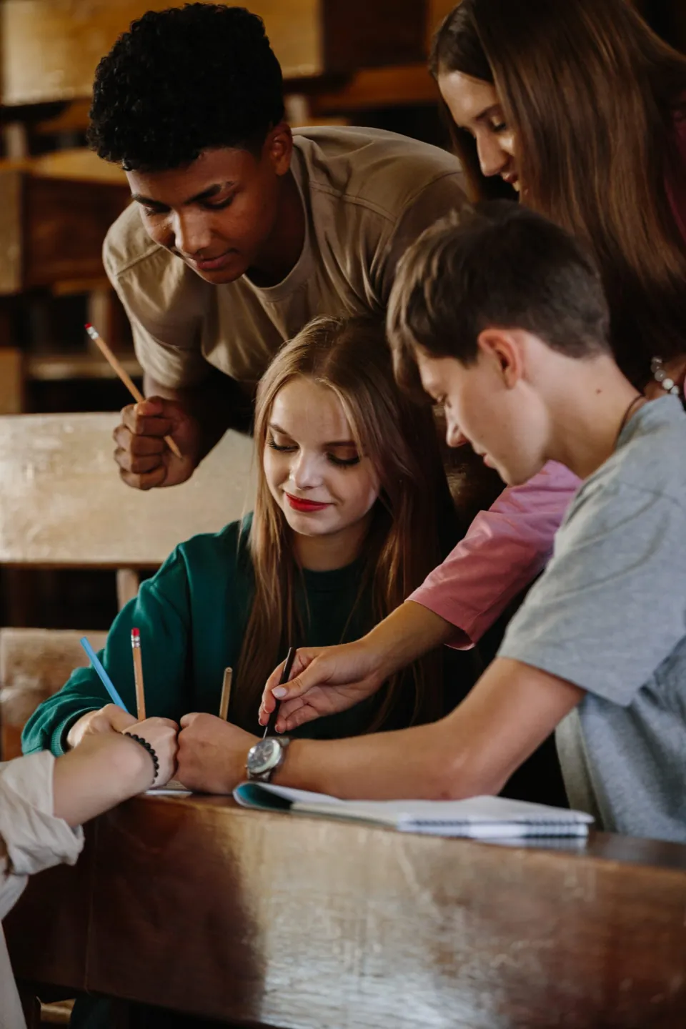 Small group of students working together in a psychoeducational skills group at Ethos Wellness