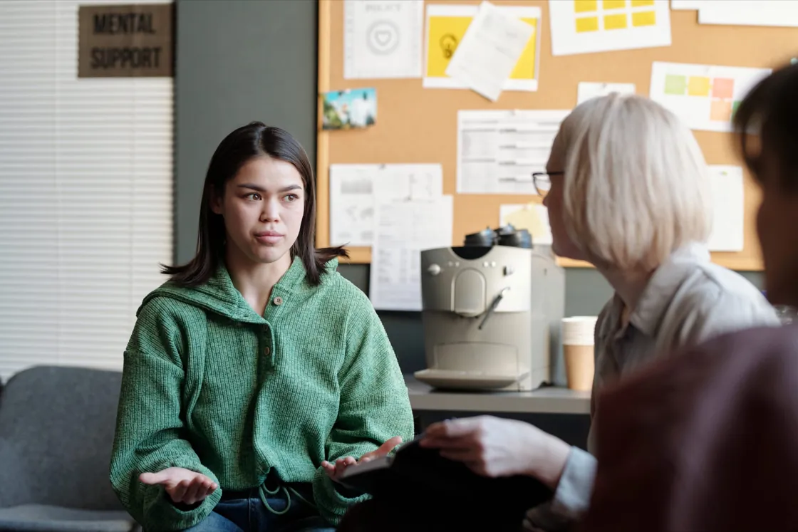 Therapist and teen client in a calm session room at Ethos Wellness