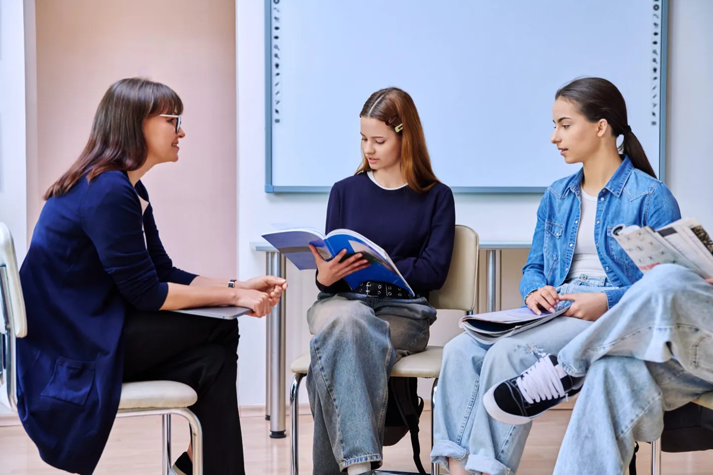 Teen and therapist talking comfortably during a counseling session at Ethos Wellness