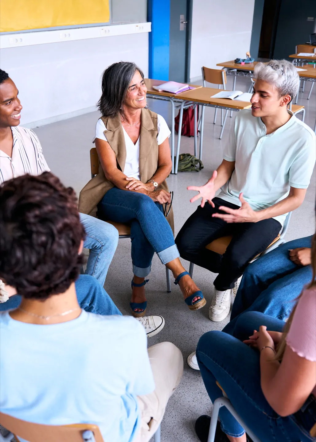 Group members listening and connecting during a session at Ethos Wellness