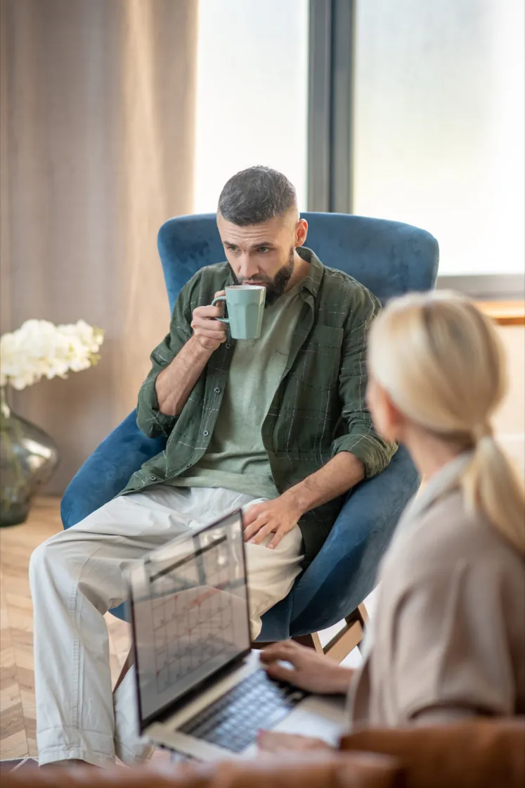 Psychiatrist speaking with an adult client during a psychiatric evaluation at Ethos Wellness