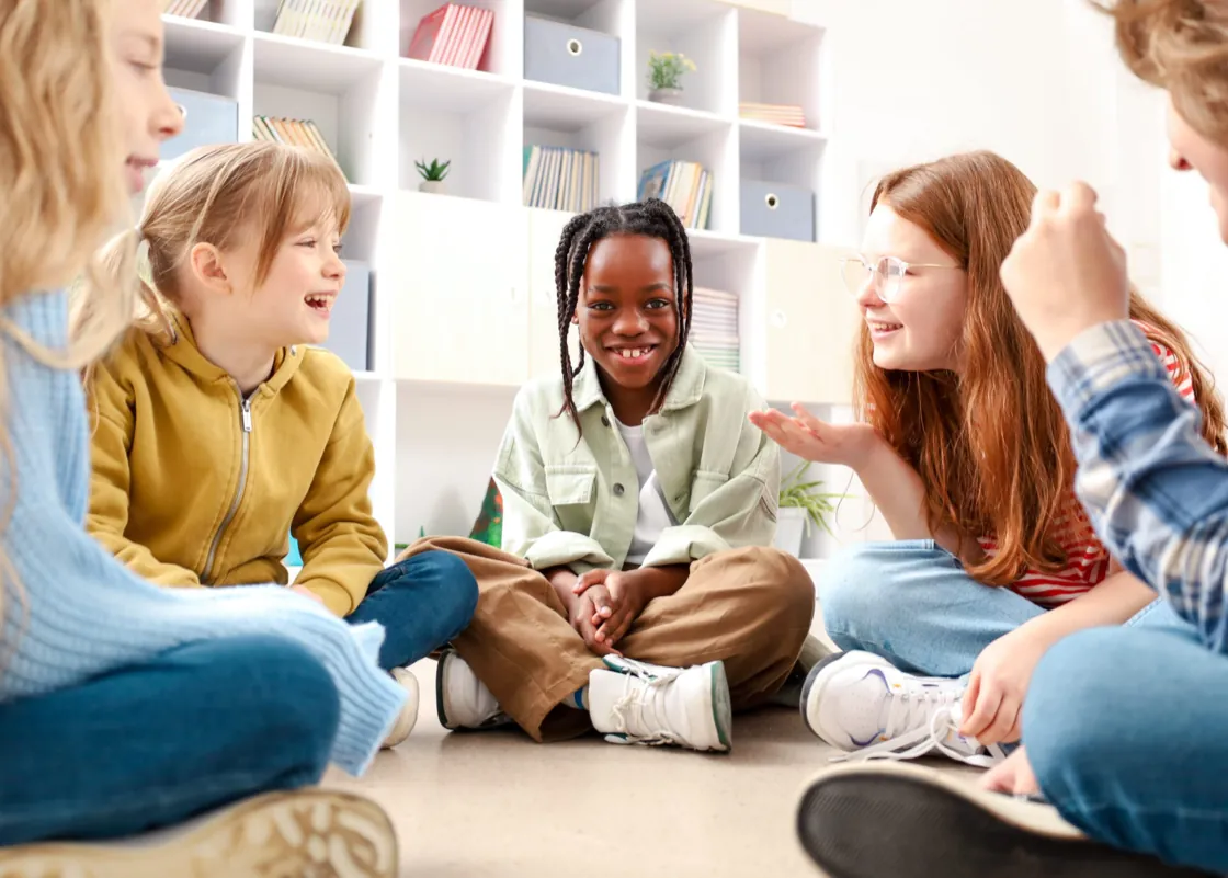 Group of children sitting in a circle during a DBT-C session at Ethos Wellness