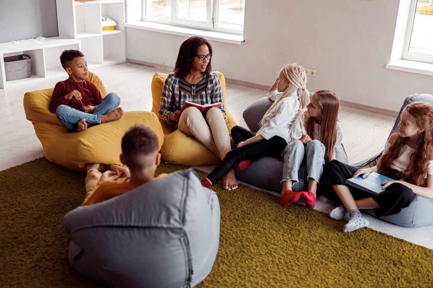 Children working together in a small group therapy session at Ethos Wellness