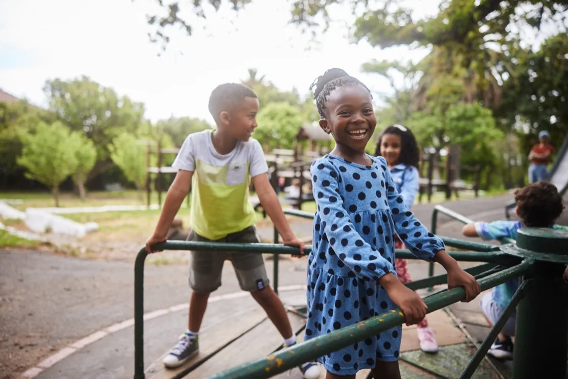 Young child smiling during a one-on-one counseling session at Ethos Wellness